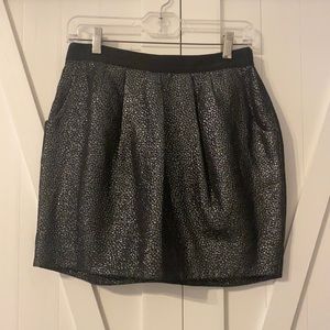 Barely worn, mini skirt with fun back detail